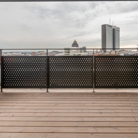 Relax on the large balcony with its city vistas