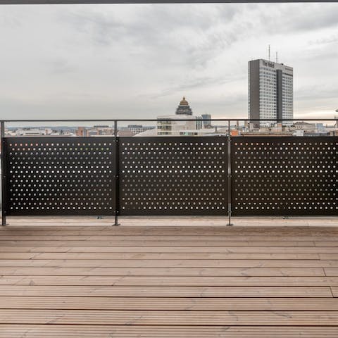 Relax on the large balcony with its city vistas