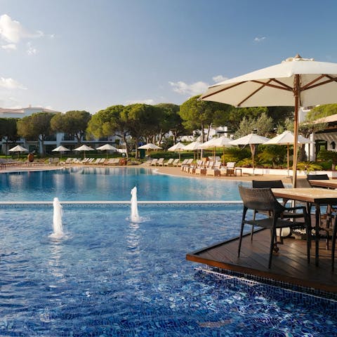Spend relaxing days by the pool or walk down to the beach