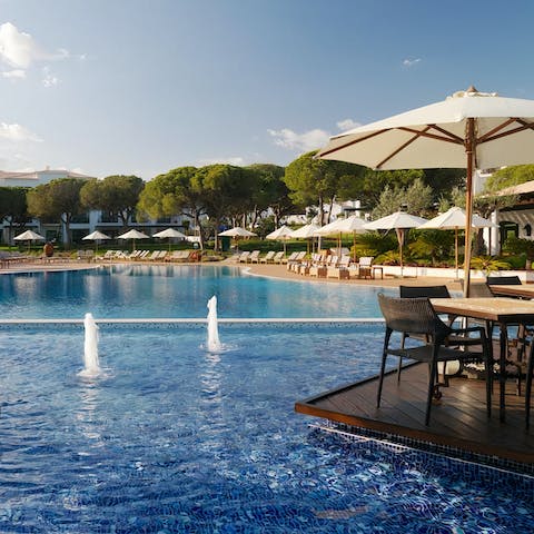 Spend relaxing days by the pool or walk down to the beach