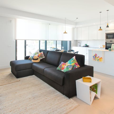Cool off from the sun in the bright living area – the sofa is an excellent place for an afternoon snooze