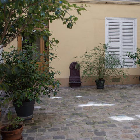 Look out to the peace and serenity of the outer courtyard