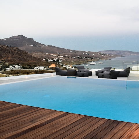 Relax by the private pool and enjoy expansive island views