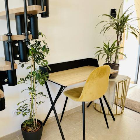 Catch up on work or embark on a new fictional journey as you sit down at the laptop-friendly workspace