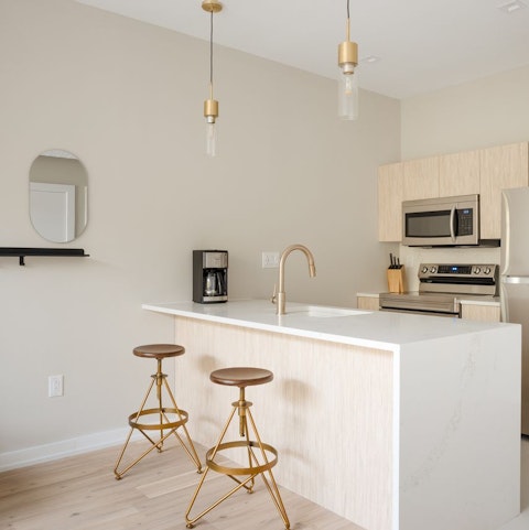 Pull up a chair at the sleek breakfast bar and sip your morning coffee