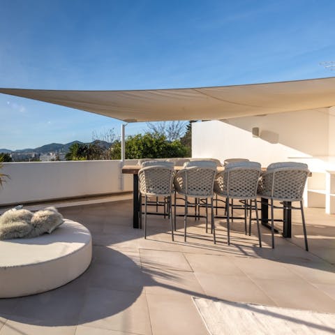 Drink wine on the roof terrace while nibbling on tapas