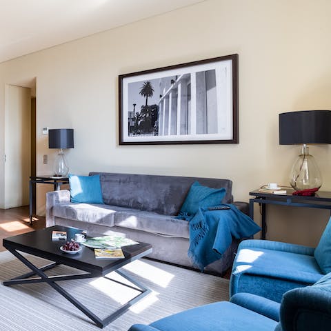 Kick back in the stylish living room with a glass of wine after a day of touring the city