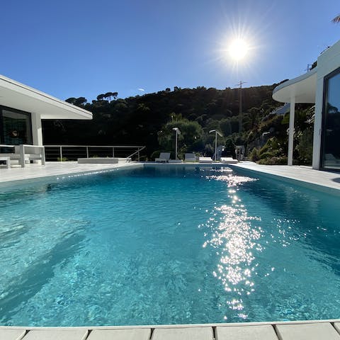 Wave to the master suite – their windows look into the pool