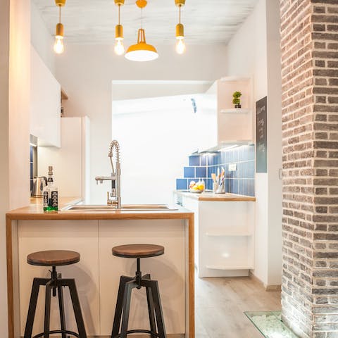 Sip ouzo at the breakfast bar after returning from Nea Chora Beach, 130 metres away