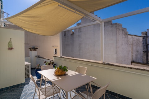 Take meals alfresco beneath a sail canopy under Salento skies