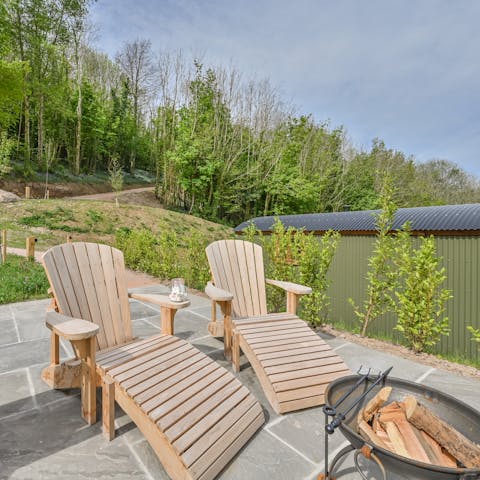 Light up the fire pit and catch the sunset by the flickering flames