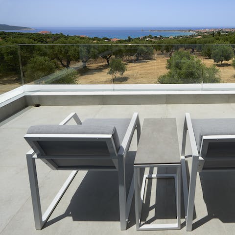 Admire the scenery from the rooftop terrace, the perfect spot to relax with a glass of wine