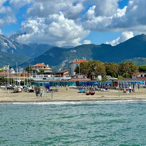 Dip your toes in the sea at local beach Forte dei Marmi