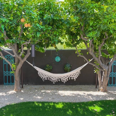 Swing back on the hammock in the garden