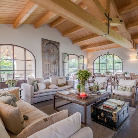 Relax in the grand, light-filled living area