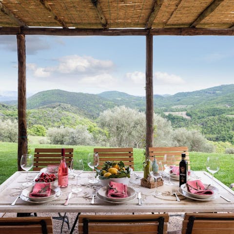 Enjoy an alfresco dinner with views across the Umbrian countryside