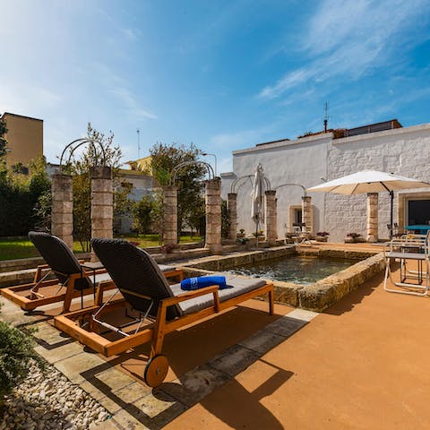 Grab a book or practice speaking Italian on a comfy sun bed