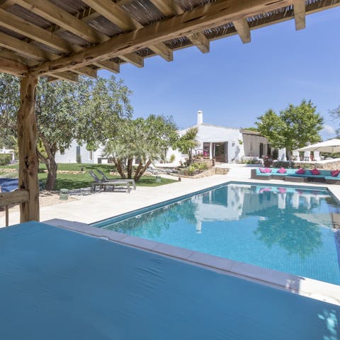 Escape the sun and take a nap in the poolside cabana