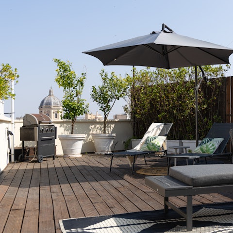 Relax on the private roof terrace with its fantastic views over Rome