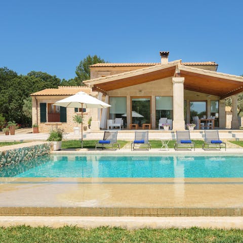 Swim in the pool as the Mallorcan sun warms your skin