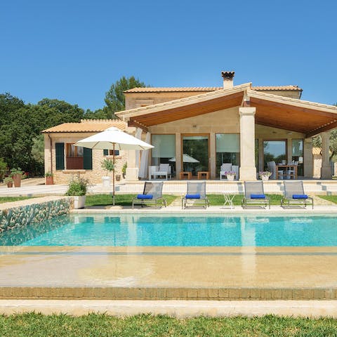 Swim in the pool as the Mallorcan sun warms your skin