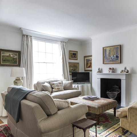 Kick back in the bright living room with a glass of bubbly after a day of London sightseeing
