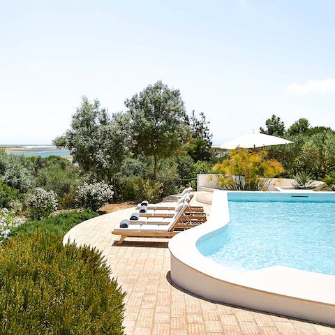 Experience total relaxation whilst lounging by the pool