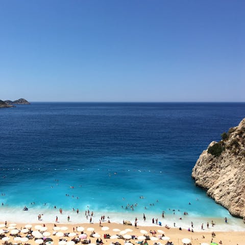 Walk down to one of the white sand beaches dotted along the coast