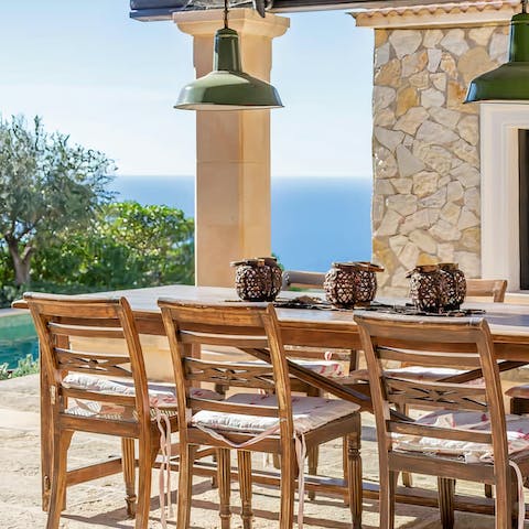 Dine al fresco with the view across the magnificent natural bay