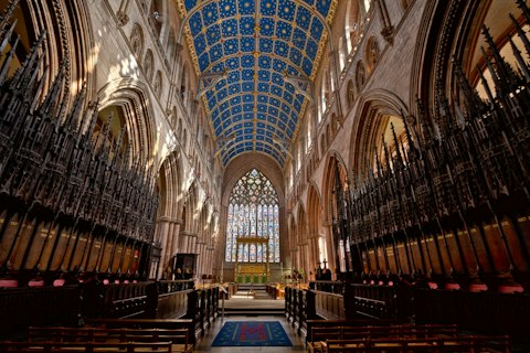 Explore Carlisle Cathedral's medieval architecture and renowned painted ceiling, a twenty-minute drive