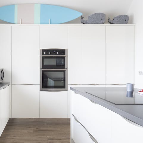 Plate up home-cooked perfection in the sleek white kitchen