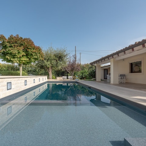 Enjoy lazy afternoons stretched out by the private pool