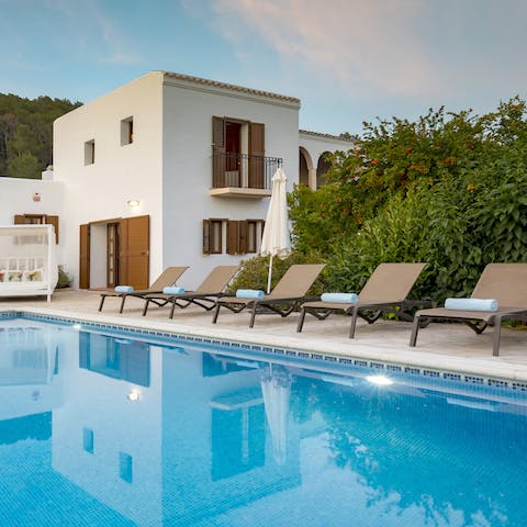 Savour a glass of sangria by the private pool