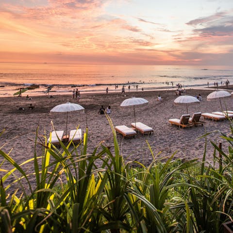 Watch the sunset at Canggu beach, around twenty-minutes drive away