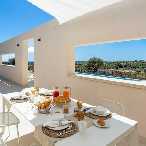 Soak in the views of the olive trees over breakfast