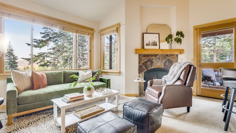 Settle in beside the stone fireplace after a day on the slopes