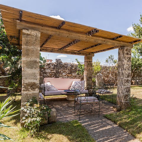 Sit out under the shade of the pergola with a morning espresso