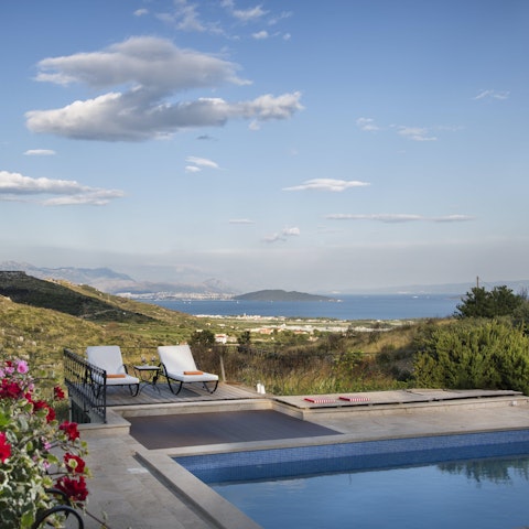 Swim in the private pool overlooking the sea