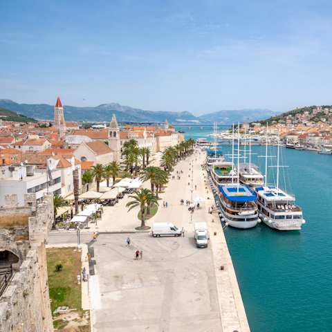 Explore Trogir, a thirteen-minute drive away