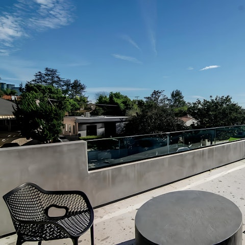 Enjoy a lie-in then sip an iced coffee on the private balcony