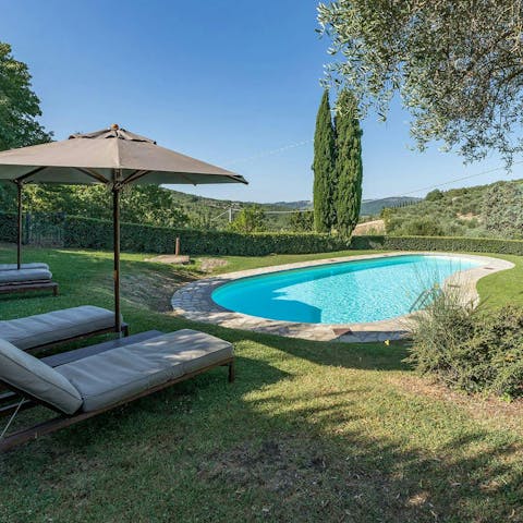 Savour the sunshine and scenery beside the communal pool