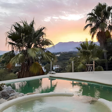 Enjoy a sunset swim overlooking the mountains
