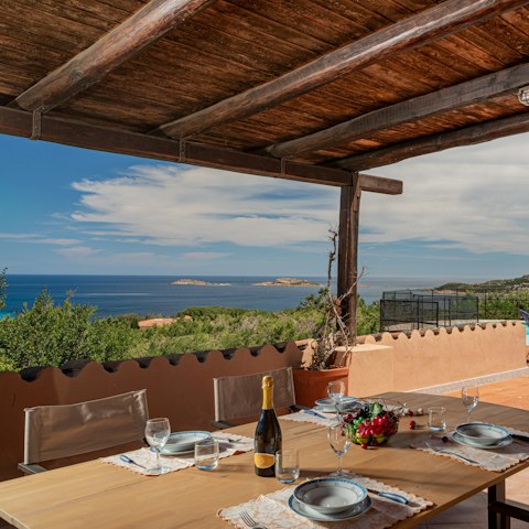 Enjoy an alfresco pasta feast at the covered dining table