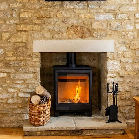 Curl up beside the log burner with a glass of wine