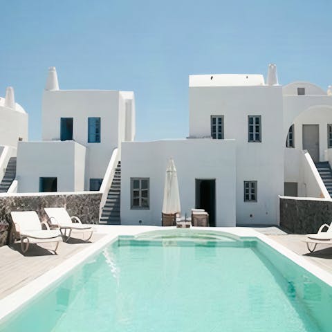 Cool off in the crystalline waters of the pool in between relaxing on a deck chair