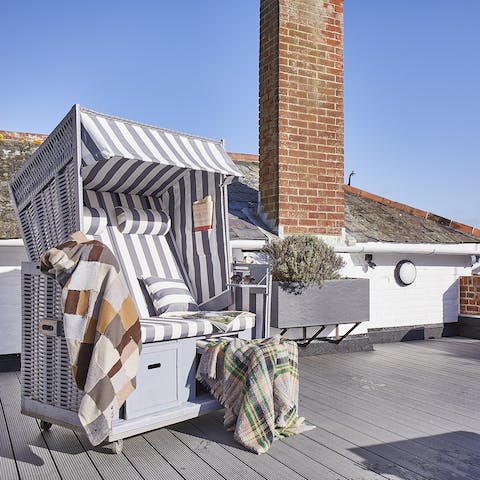 Get comfortable on the roof terrace on a sunny afternoon