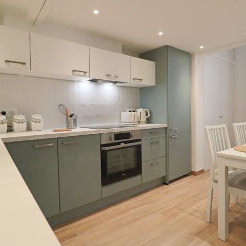 Prepare meals or snacks in the convenient kitchen