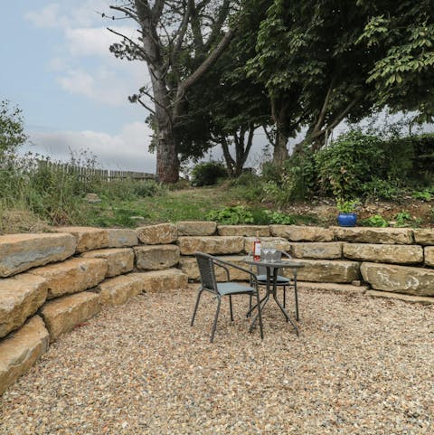 Wind down after a busy day with a bottle of wine in the garden