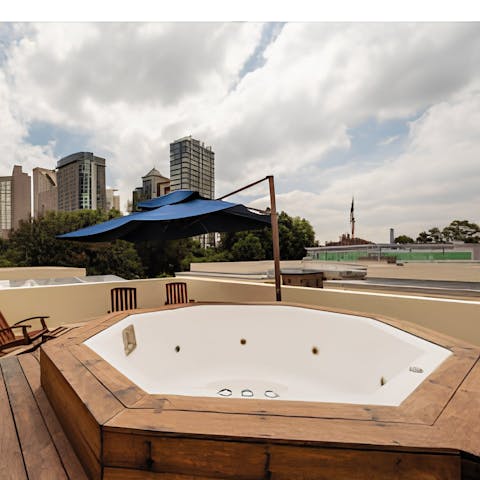 Take in the city skyline views from the shared rooftop terrace and Jacuzzi