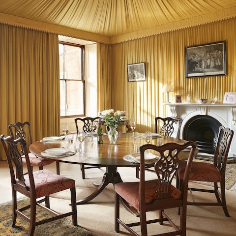 Dine in style beneath fabric-draped walls